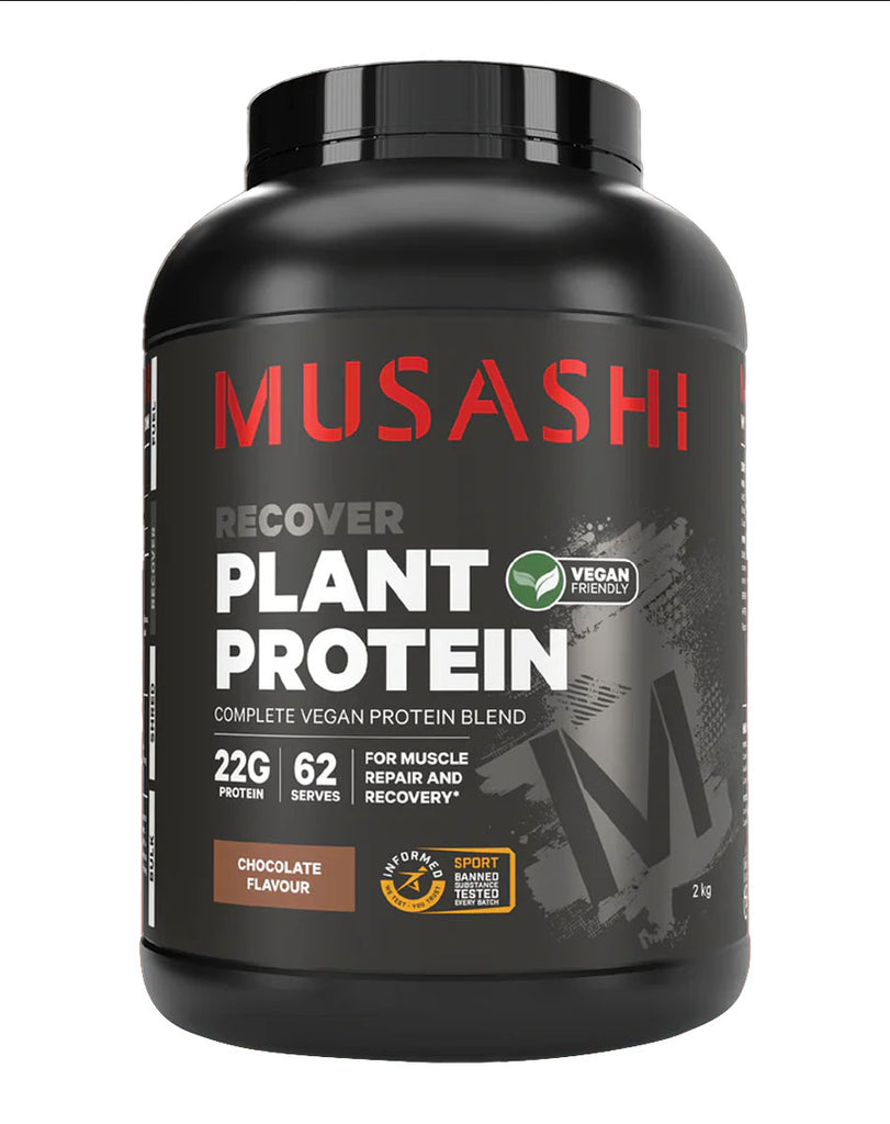 Front view of Musashi Plant Protein Chocolate 2kg – matte black container with red branding, silver “M” graphic, brown flavour box, and 22g protein per serve.